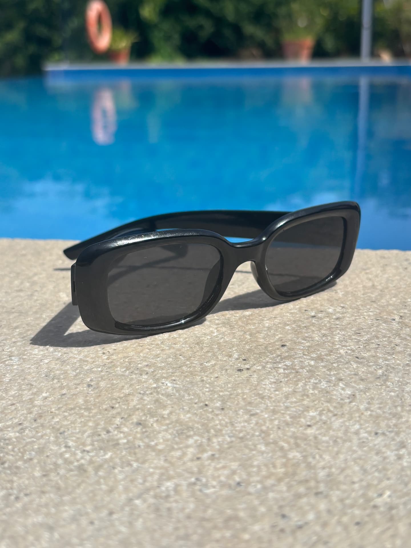Close detail of the polished acetate frame and smoke lenses